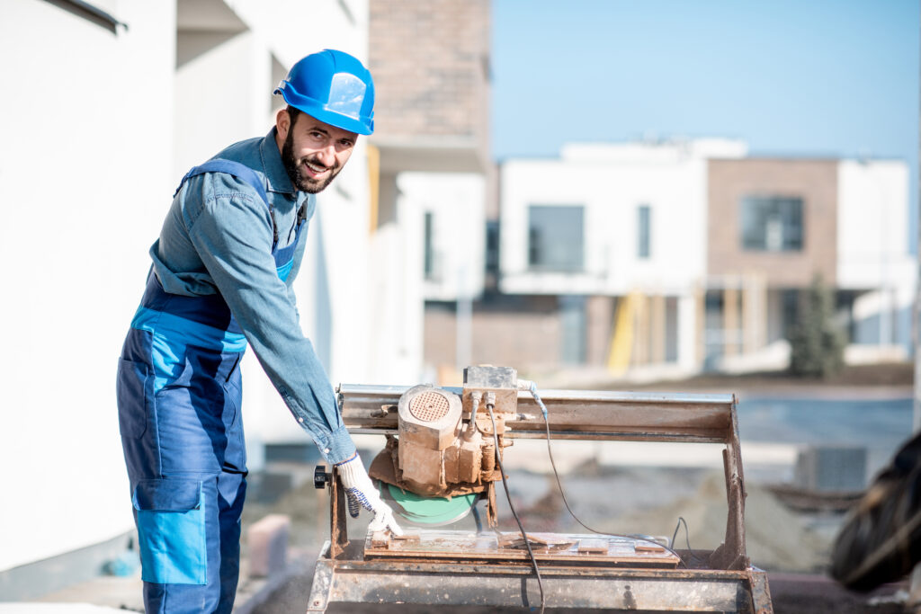 man with electro saw on the construction site 2026 01 08 22 39 00 utc