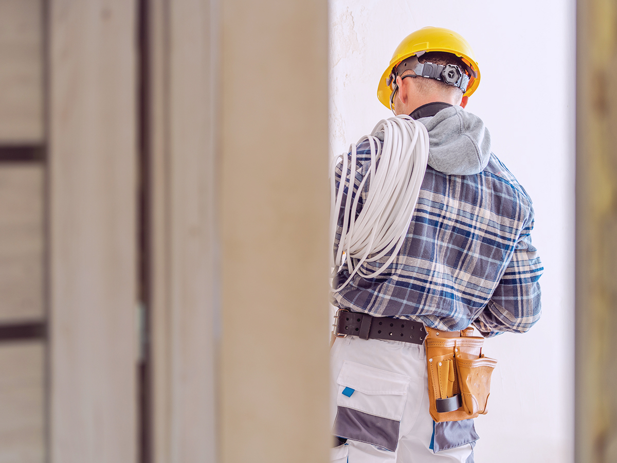A construction worker engaging in Extensive Remodeling Projects on a home