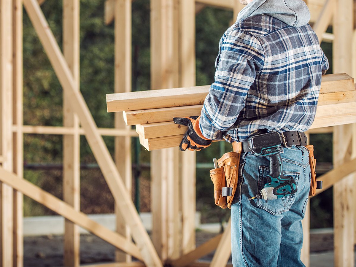 Contruction worker providing House Elevation Services at a site